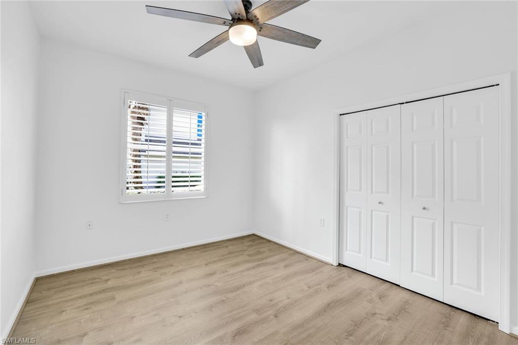 6875 Ascot Drive, Unit 6 Naples, FL 34113 - Photo 17 of 31 a view of an empty room with a window
