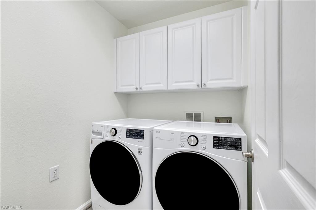 6875 Ascot Drive, Unit 6 Naples, FL 34113 - Photo 20 of 31 a utility room with dryer and washer
