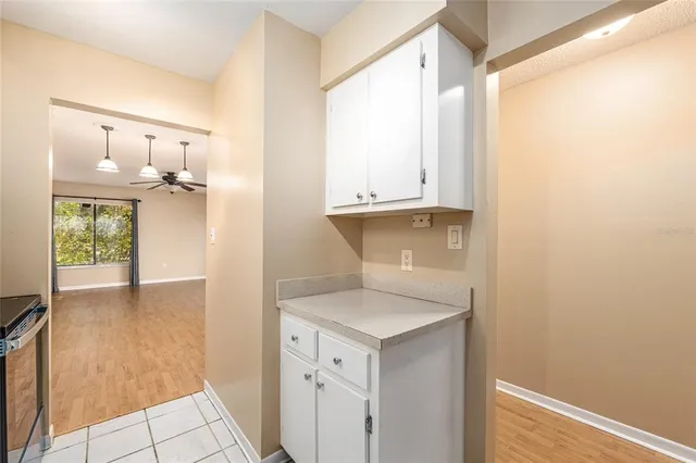 a view of cabinets and wooden floor