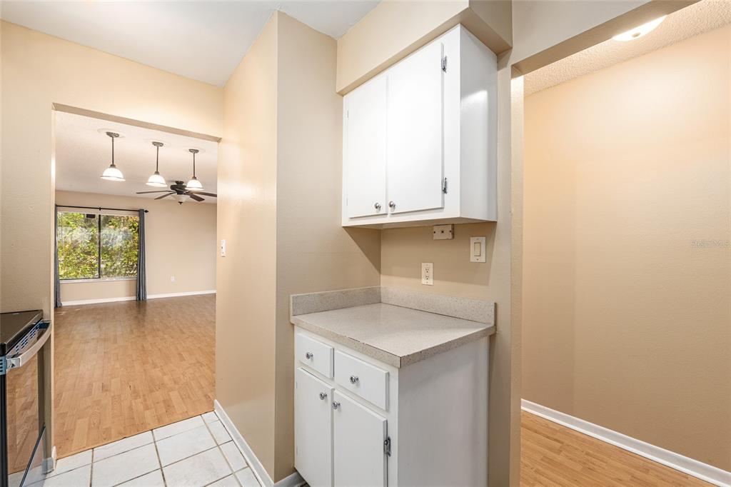 3057 Northwest 28th Circle Gainesville, FL 32605 - Photo 16 of 50 a view of cabinets and wooden floor