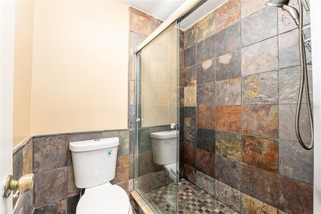 3057 Northwest 28th Circle Gainesville, FL 32605 - Photo 20 of 50 a white toilet sitting next to a bathroom sink