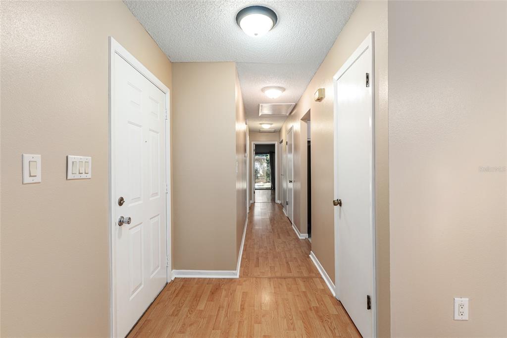 3057 Northwest 28th Circle Gainesville, FL 32605 - Photo 24 of 50 a view of a hallway with wooden floor