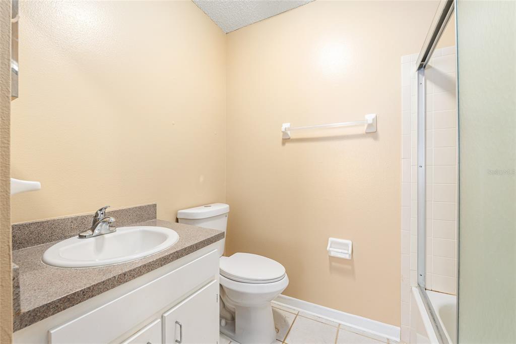 3057 Northwest 28th Circle Gainesville, FL 32605 - Photo 29 of 50 a bathroom with a sink toilet and a mirror