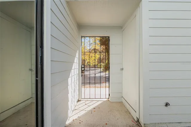 a view of a livingroom with an empty space and a window