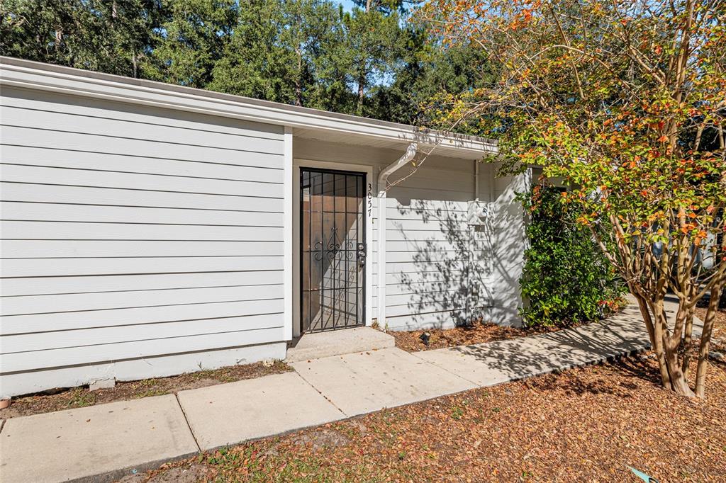 3057 Northwest 28th Circle Gainesville, FL 32605 - Photo 38 of 50 a view of a house with a door