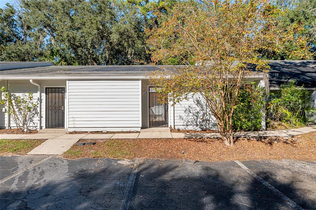 3057 Northwest 28th Circle Gainesville, FL 32605 - Photo 40 of 50 a view of a house with a yard and garage