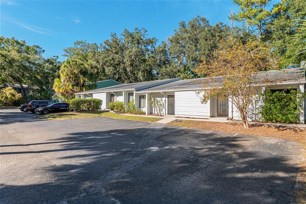 3057 Northwest 28th Circle Gainesville, FL 32605 - Photo 42 of 50 a front view of a house with a garden and yard