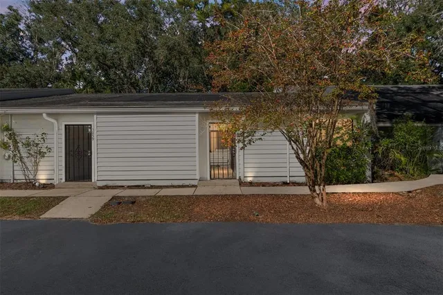 a view of a house with a yard and garage