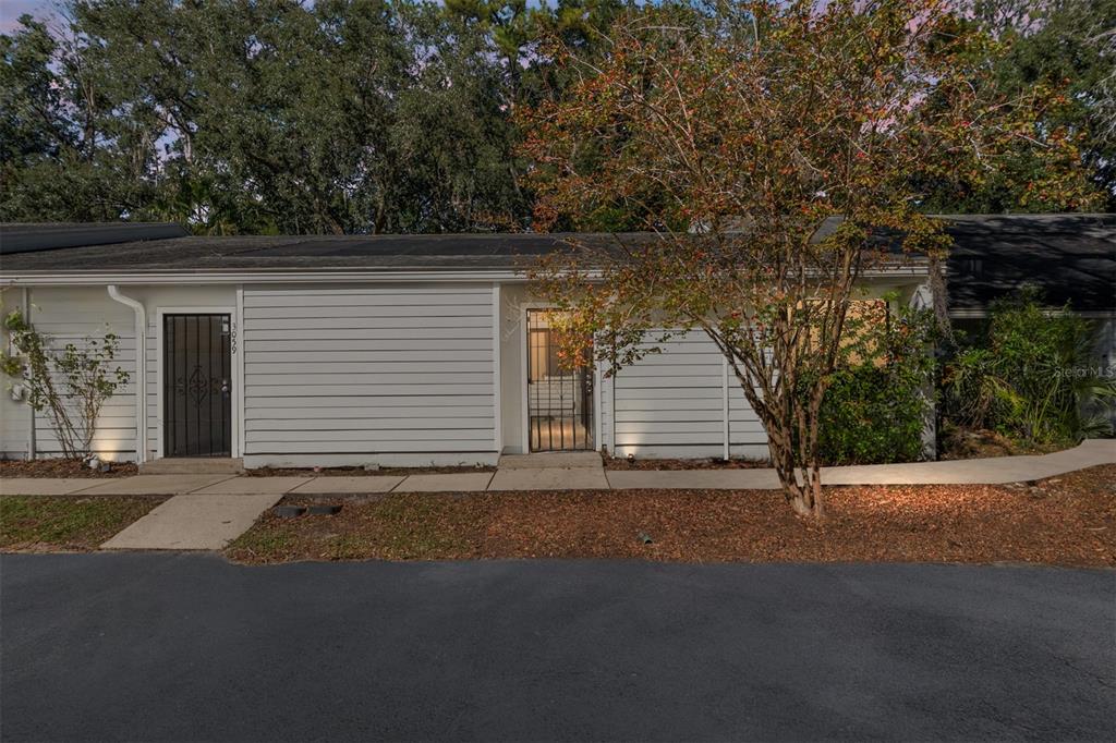 3057 Northwest 28th Circle Gainesville, FL 32605 - Photo 50 of 50 a view of a house with a yard and garage
