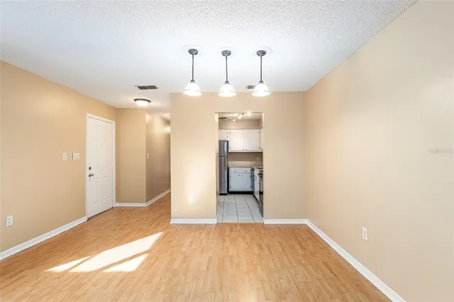 a view of a kitchen with a sink and cabinets