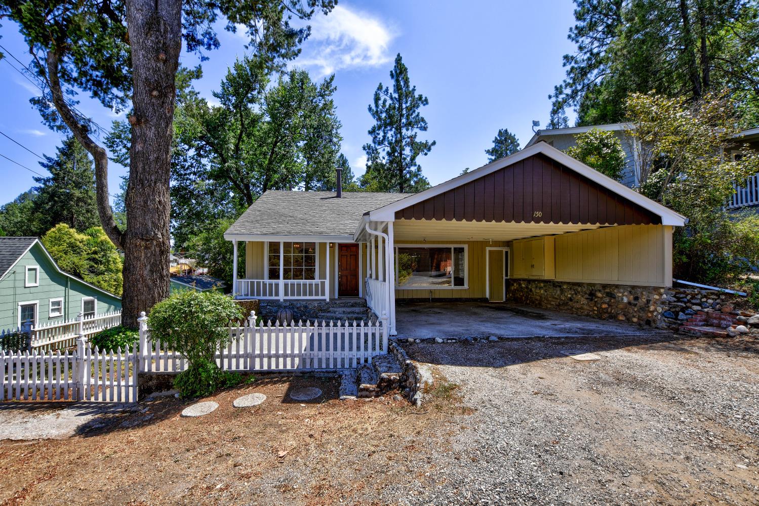 a front view of a house with garden