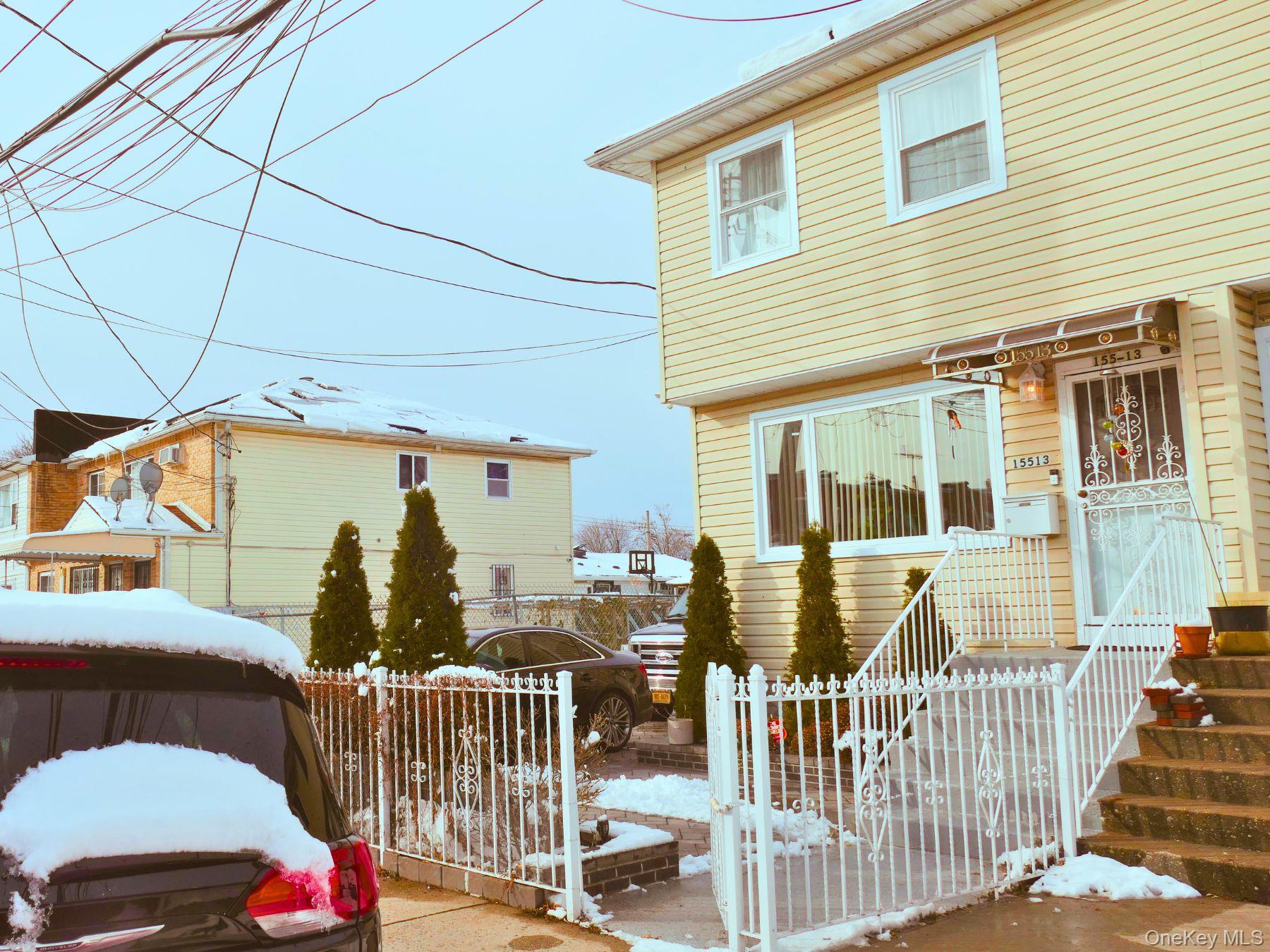 View of front of property featuring a gate