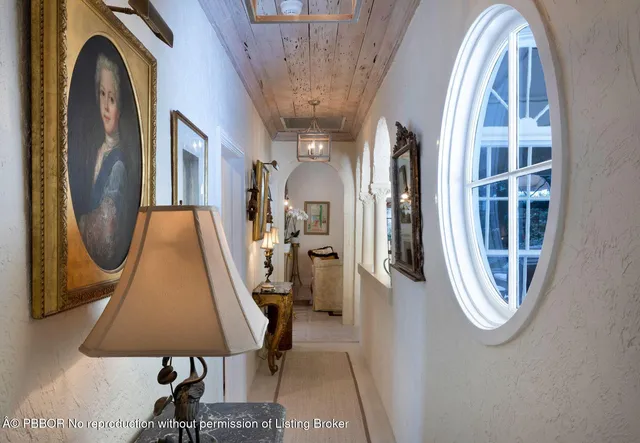 a view of a livingroom with furniture and a floor to ceiling window