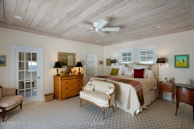 a room with a bed and furniture