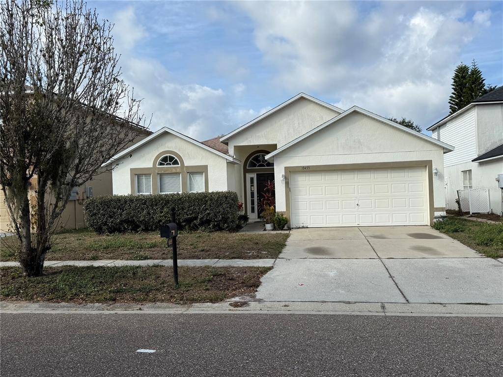 10455 Fly Fishing Street Riverview, FL 33569 - Photo 2 of 25 a front view of a house with a yard and garage