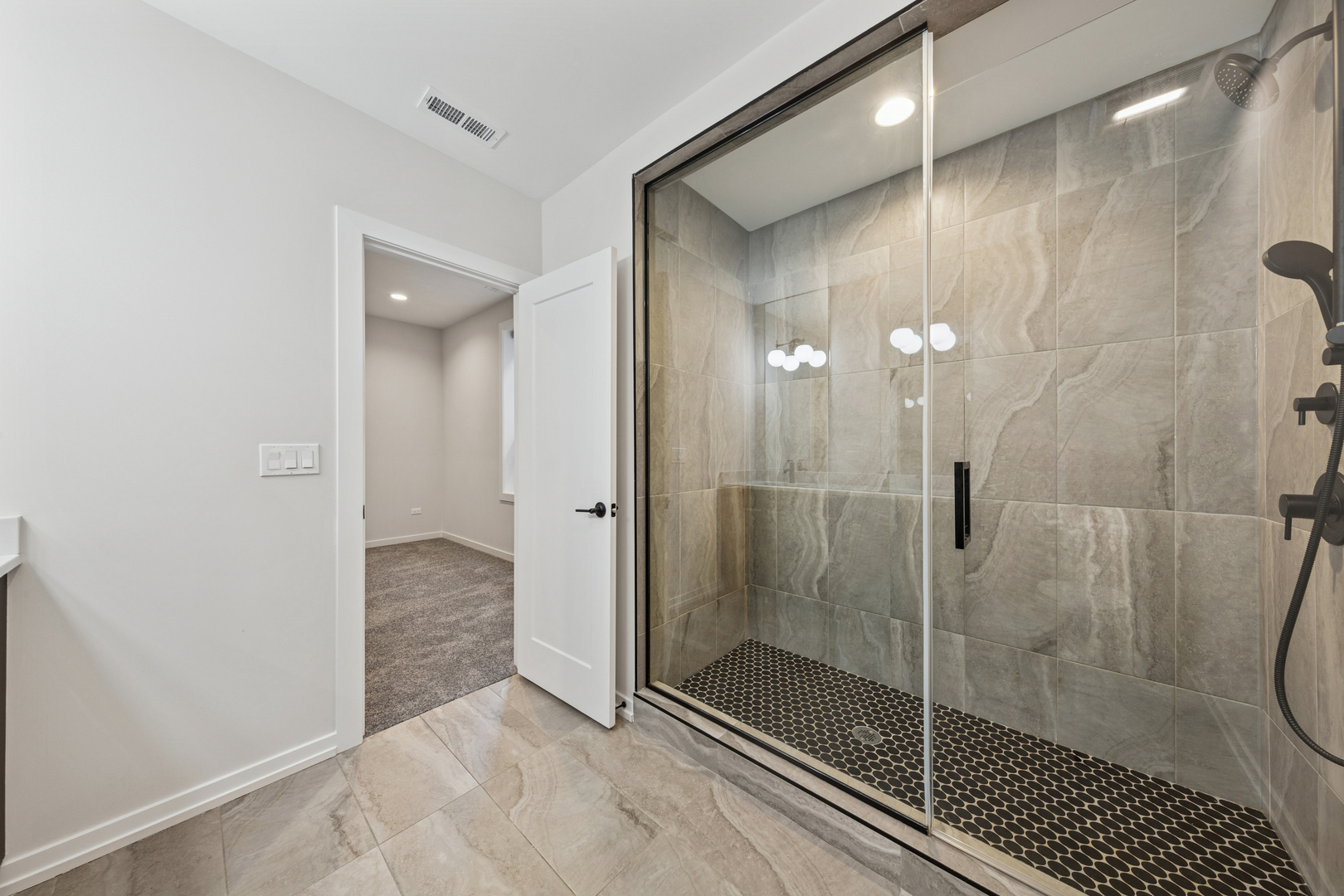 4904 South St Lawrence Avenue, Unit 2 Chicago, IL 60615 - Photo 17 of 19 a bathroom with a glass shower door