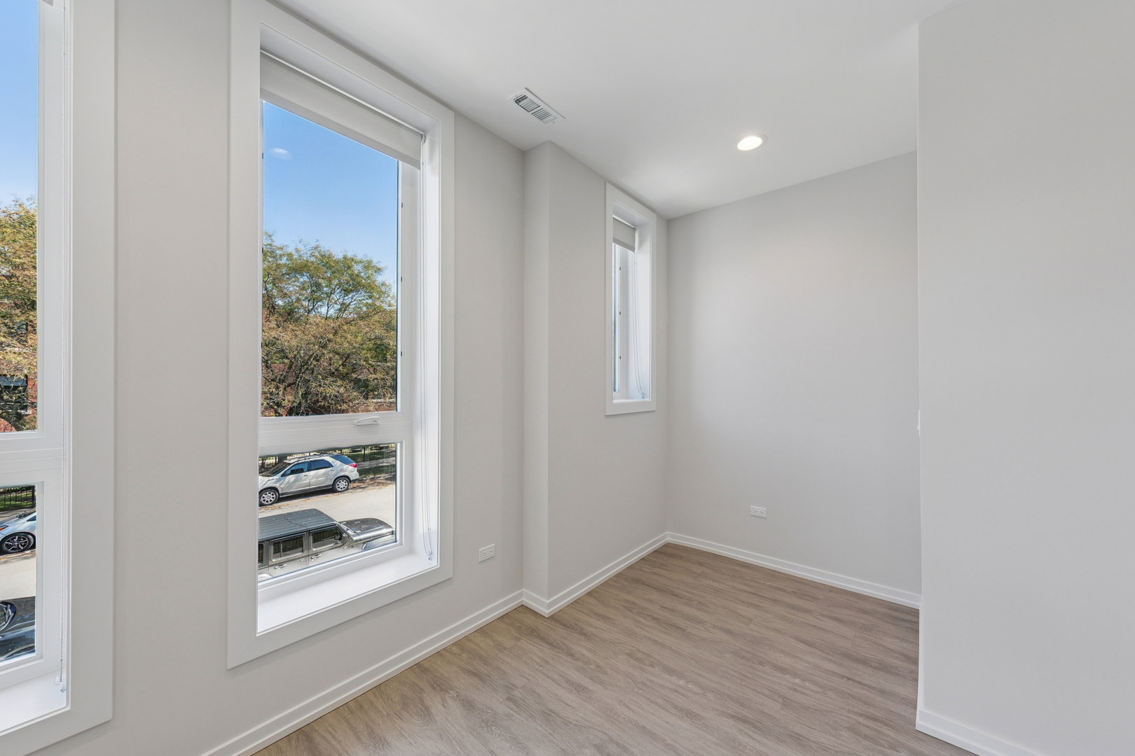4904 South St Lawrence Avenue, Unit 2 Chicago, IL 60615 - Photo 6 of 19 a view of a hallway with wooden floor and a window