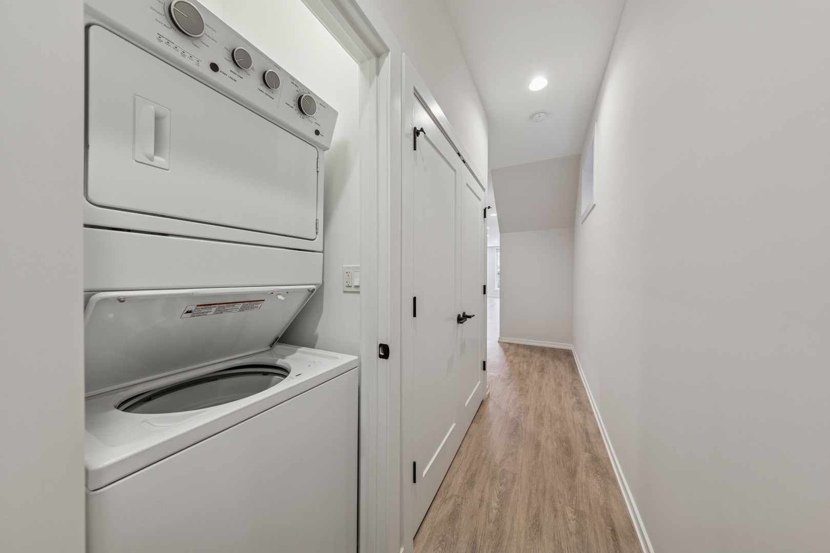 4904 South St Lawrence Avenue, Unit 2 Chicago, IL 60615 - Photo 10 of 19 a view of washer and dryer with wooden floor