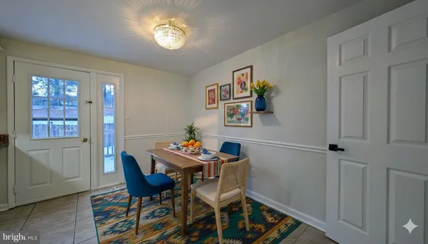 a dining room with furniture and window