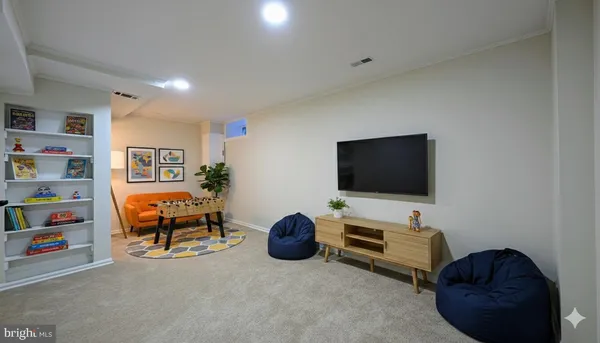 a livingroom with workspace and a couch