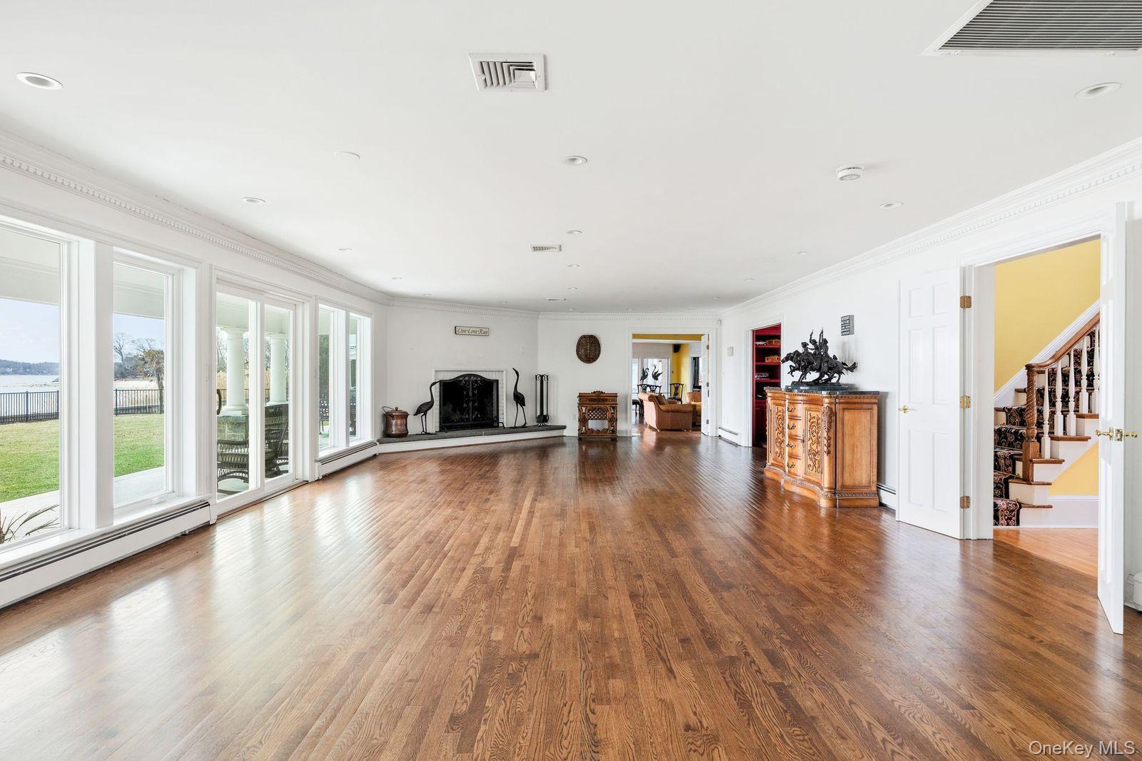 33 Beach Road Northport, NY 11768 - Photo 8 of 50 a living room with furniture and a large window
