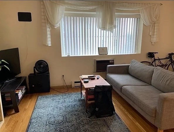 10 Scottfield Road, Unit 14 Boston, MA 02134 - Photo 2 of 7 a living room with furniture and a window