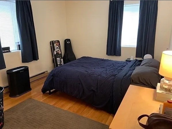 10 Scottfield Road, Unit 14 Boston, MA 02134 - Photo 6 of 7 a bedroom with a bed and a window