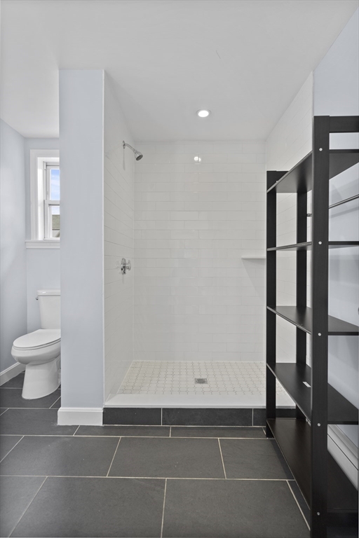 155 5th Street, Unit PH Cambridge, MA 02141 - Photo 7 of 9 a bathroom with a toilet and a shower