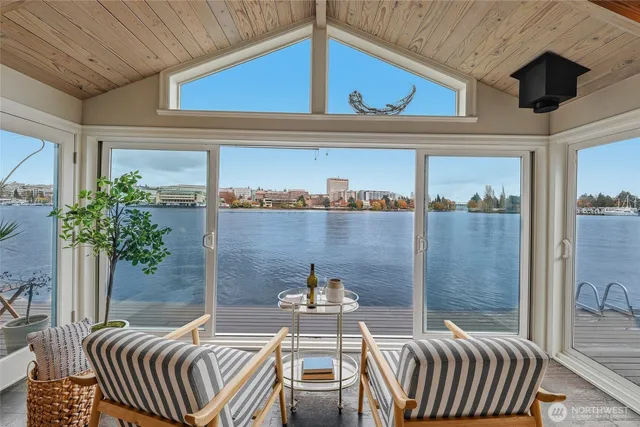 a view of a balcony dining area and chandelier