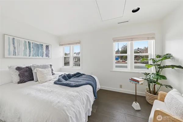 a bedroom with a bed and window