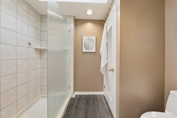 a bathroom with a bathtub and shower