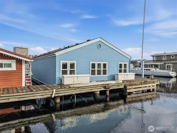 a view of house with a large window and wooden floor