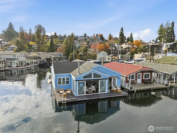 a aerial view of a house with swimming pool and deck