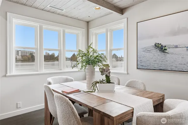 a view of a dining room with furniture and window