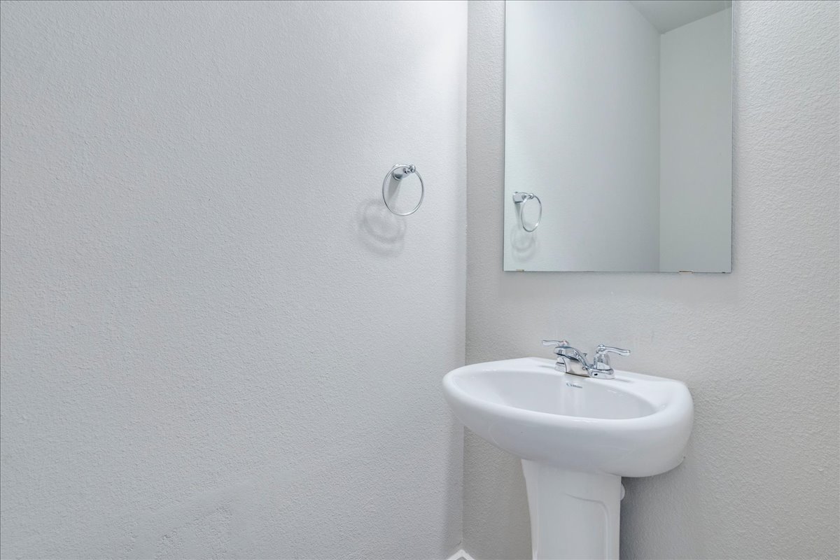 144 Threshing Road, Unit A Buda, TX 78610 - Photo 19 of 35 Half bath located downstairs.
