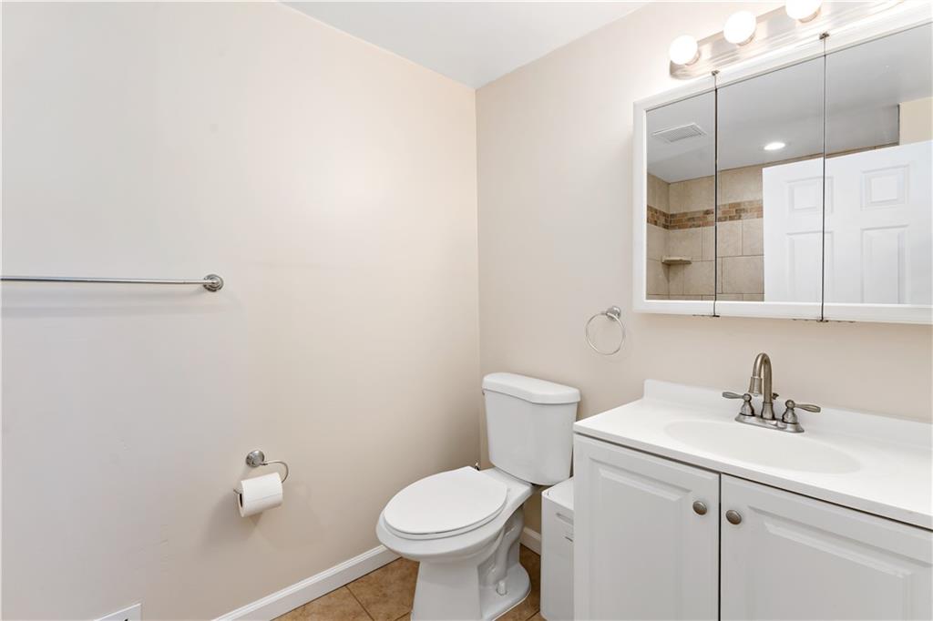 357 Gregg Street Carnegie, PA 15106 - Photo 17 of 34 a bathroom with a toilet sink and mirror