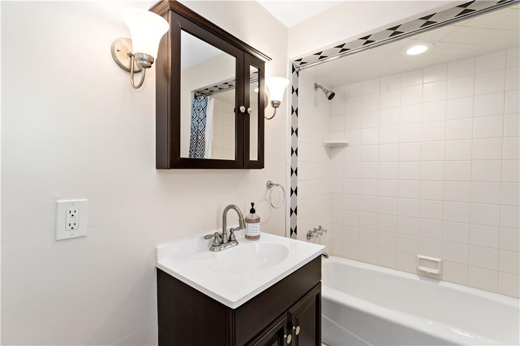 357 Gregg Street Carnegie, PA 15106 - Photo 22 of 34 a bathroom with a sink mirror and a shower