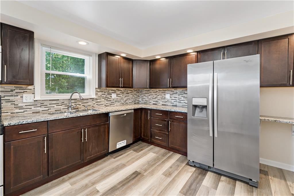 357 Gregg Street Carnegie, PA 15106 - Photo 10 of 34 a kitchen with stainless steel appliances granite countertop a refrigerator and a sink