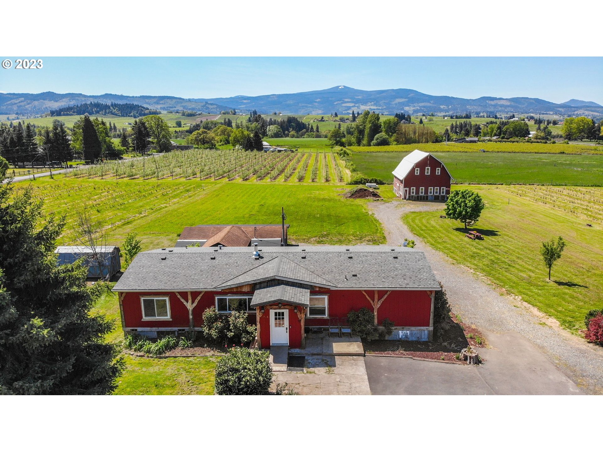 2766 Eastside Road Hood River, OR 97031 - Photo 1 of 30 a aerial view of a house with a big yard and large trees