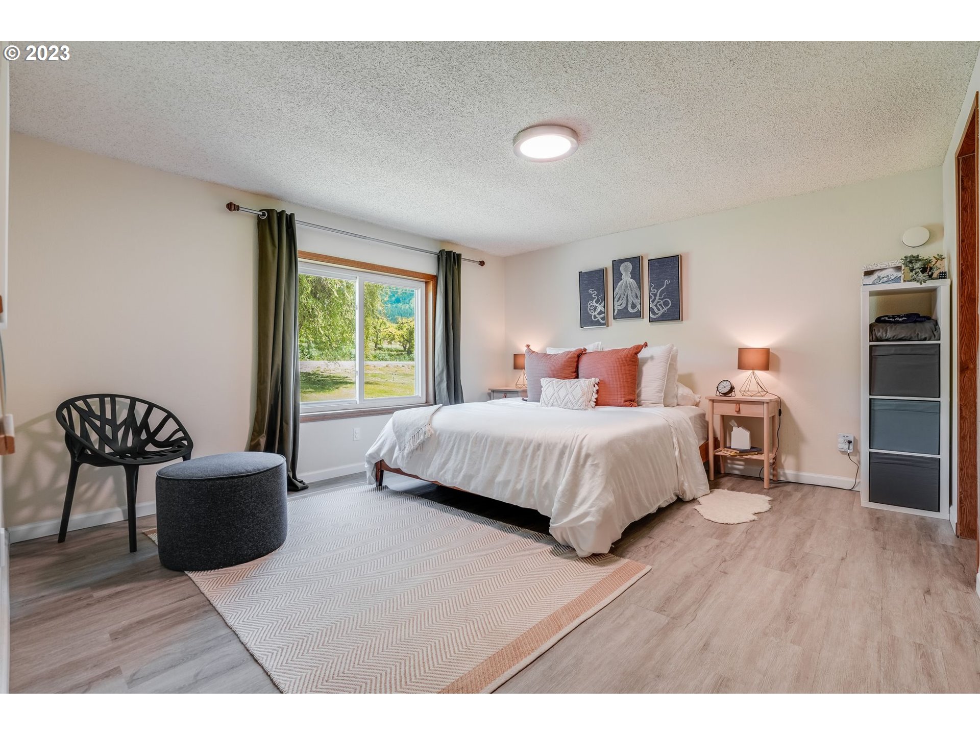 2766 Eastside Road Hood River, OR 97031 - Photo 13 of 30 a bedroom with a bed and chair