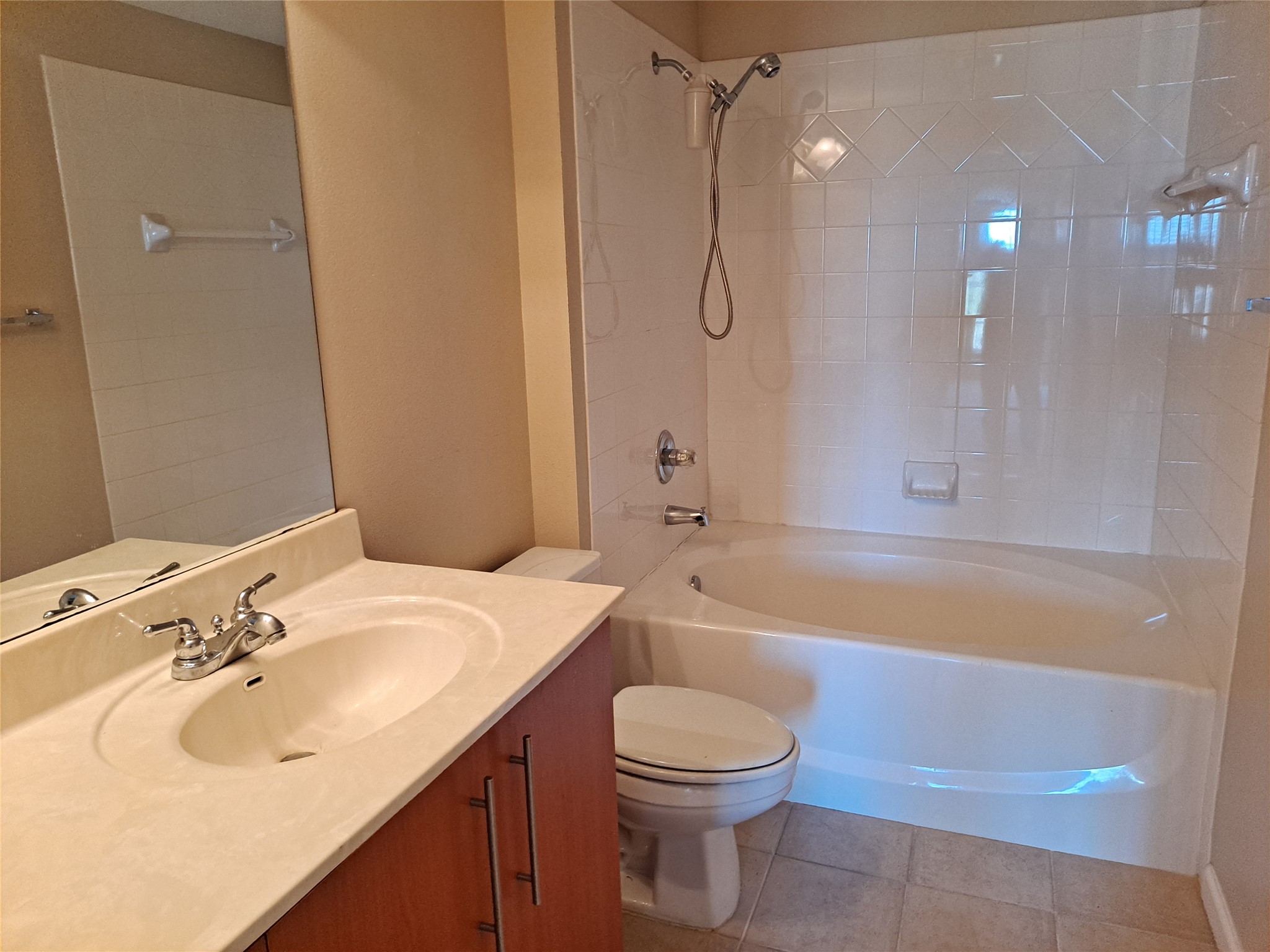 11203 Ranch Road 2222, Unit 2404 Austin, TX 78730 - Photo 11 of 28 Full bathroom with vanity, tub / shower combination, and light tile patterned flooring
