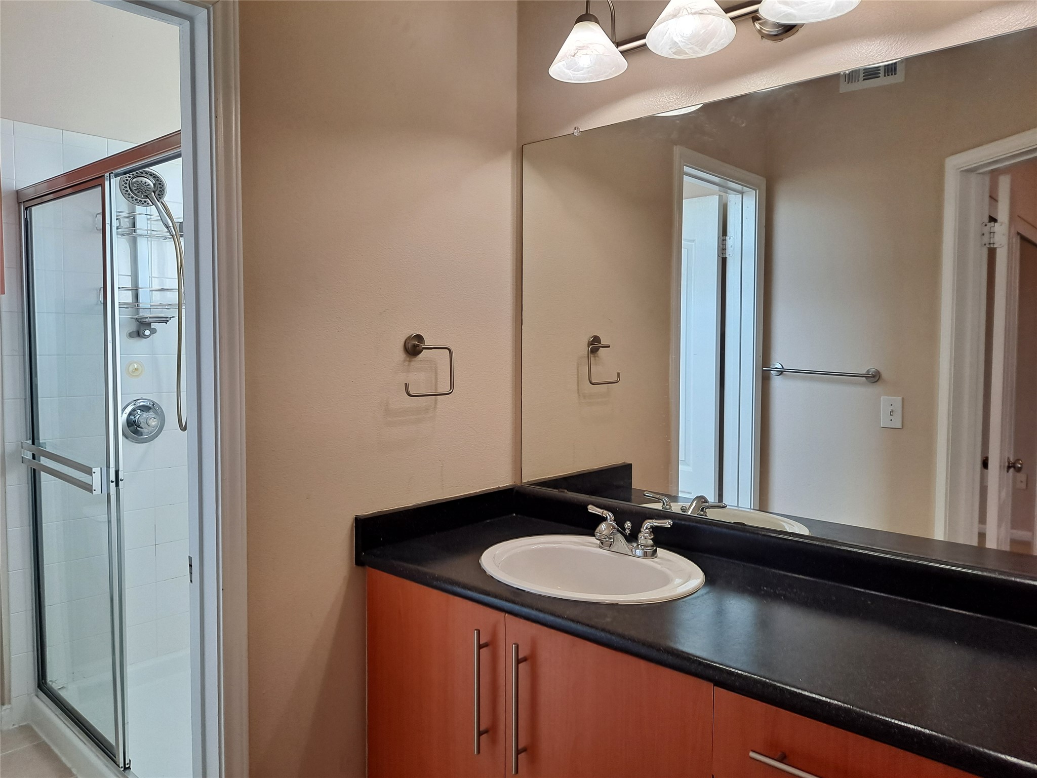 11203 Ranch Road 2222, Unit 2404 Austin, TX 78730 - Photo 14 of 28 Full bath featuring vanity and a shower stall