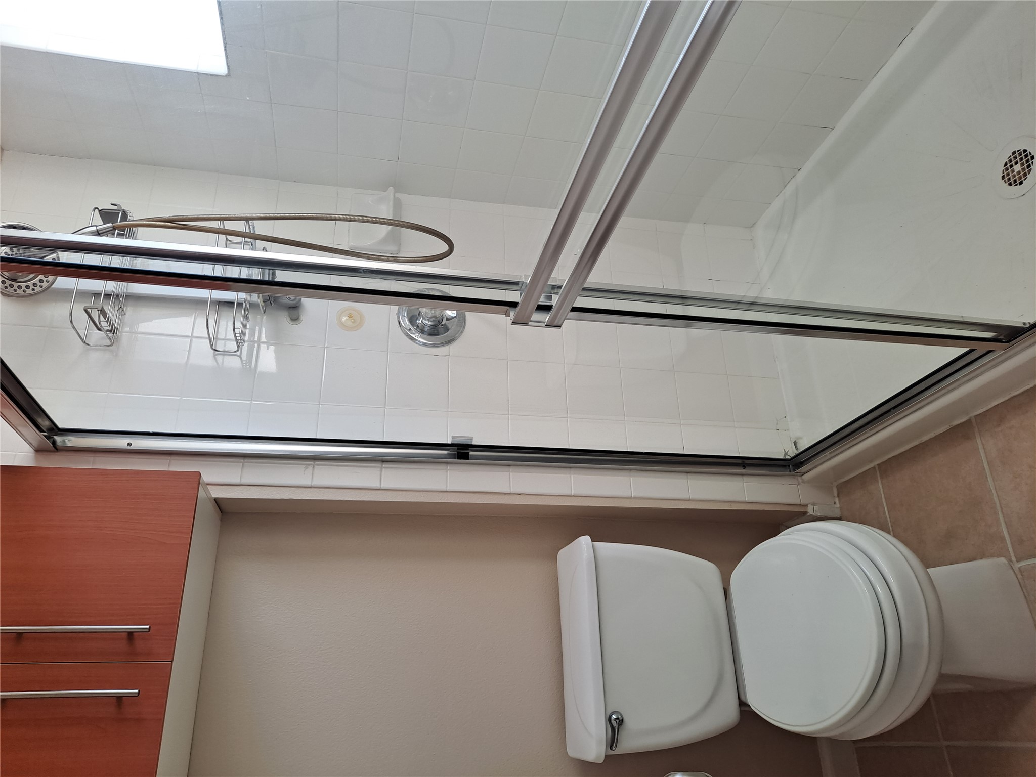 11203 Ranch Road 2222, Unit 2404 Austin, TX 78730 - Photo 15 of 28 Bathroom with a stall shower and light tile patterned flooring