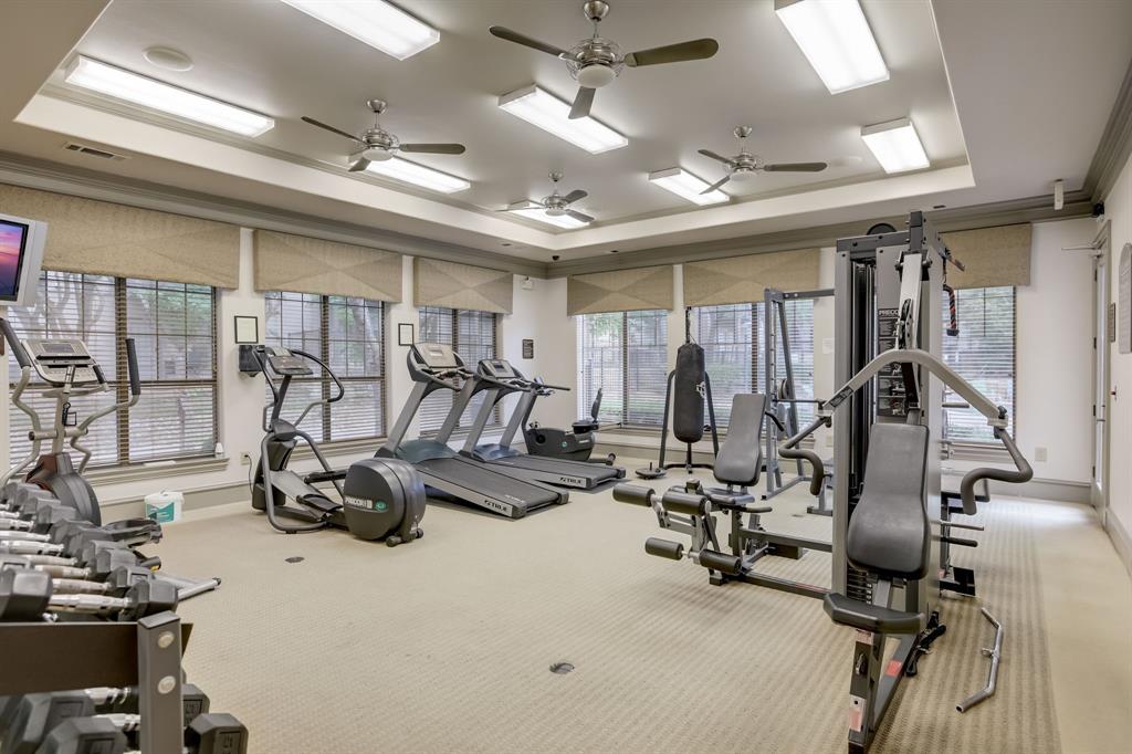 11203 Ranch Road 2222, Unit 2404 Austin, TX 78730 - Photo 21 of 28 Gym with a raised ceiling and ornamental molding
