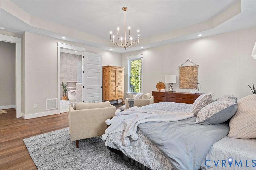 4764 Gooden Trail Quinton, VA 23141 - Photo 30 of 50 Bedroom featuring a raised ceiling, wood finished