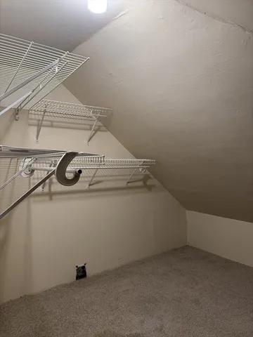 a view of storage and utility room with washer and dryer