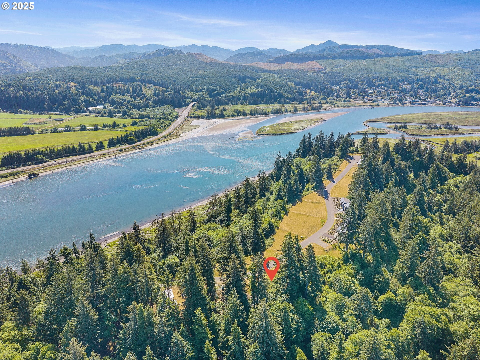 West Point Drive, Unit TL 2000 Nehalem, OR 97131 - Photo 3 of 10 a view of a lake with a mountain