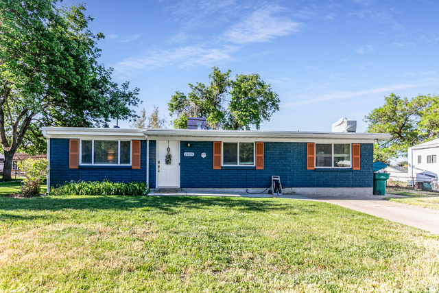 1619 Davis Drive Layton, UT 84041 - Photo 4 of 27 Ranch-style residence featuring a blue brick exterior with white trim and wooden shutters