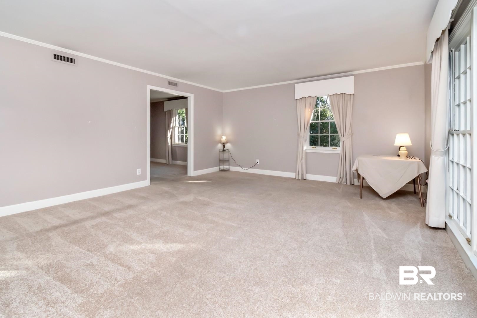 308 Brawood Drive Mobile, AL 36608 - Photo 2 of 33 Carpeted spare room featuring crown molding