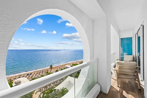 a view of balcony with furniture